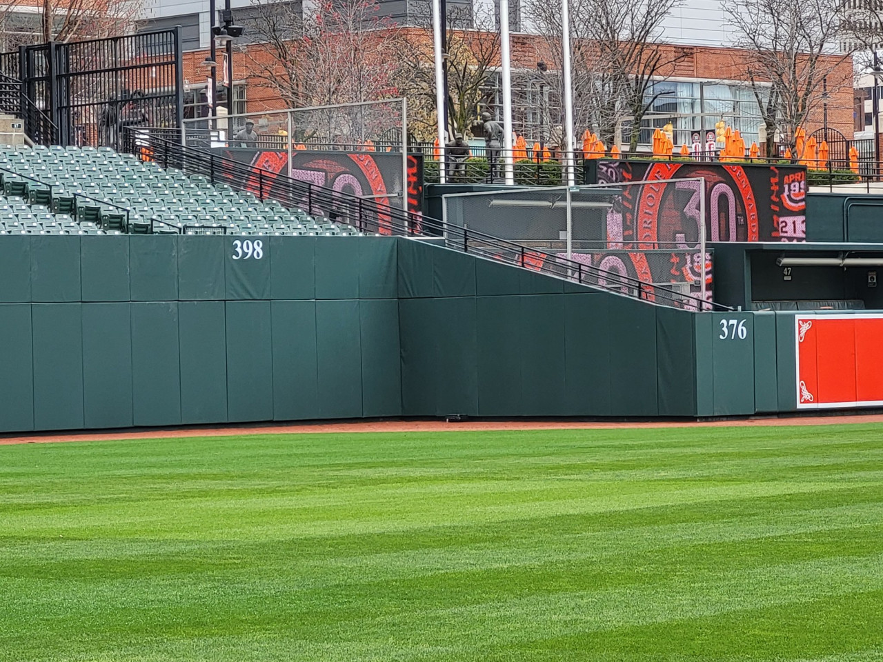 Adding the finishing touches to the new left-field wall at the