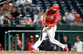Jeimer Candelario hitting in red