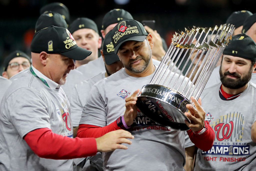 martinez holds trophy