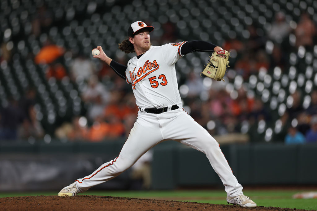 Mike Baumann pitching white