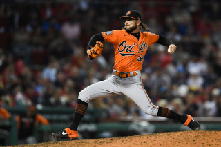 Cionel Perez throwing orange road