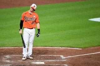 Austin Hays batting orange